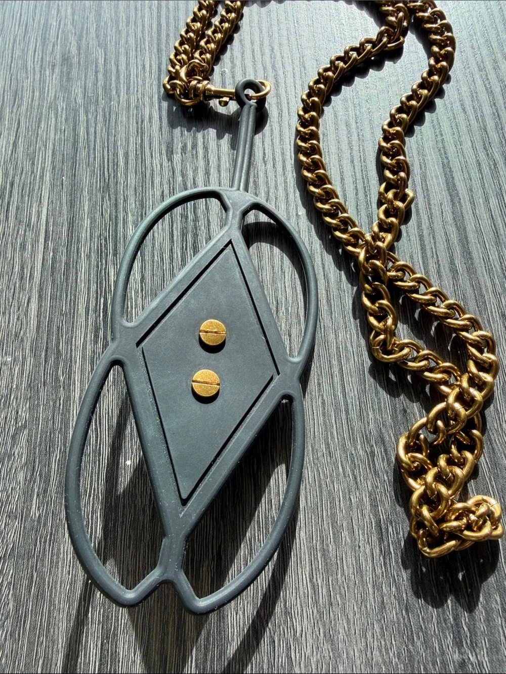 Kurt Geiger Black and Gold Eagle Phone Charm Chain